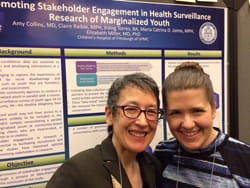 Liz Miller and colleague in front of poster