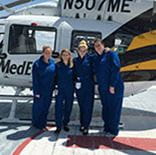 Four fellows standing by STAT MedEvac helicopter