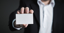 Person holding blank business card