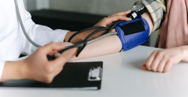 Person having blood pressure checked